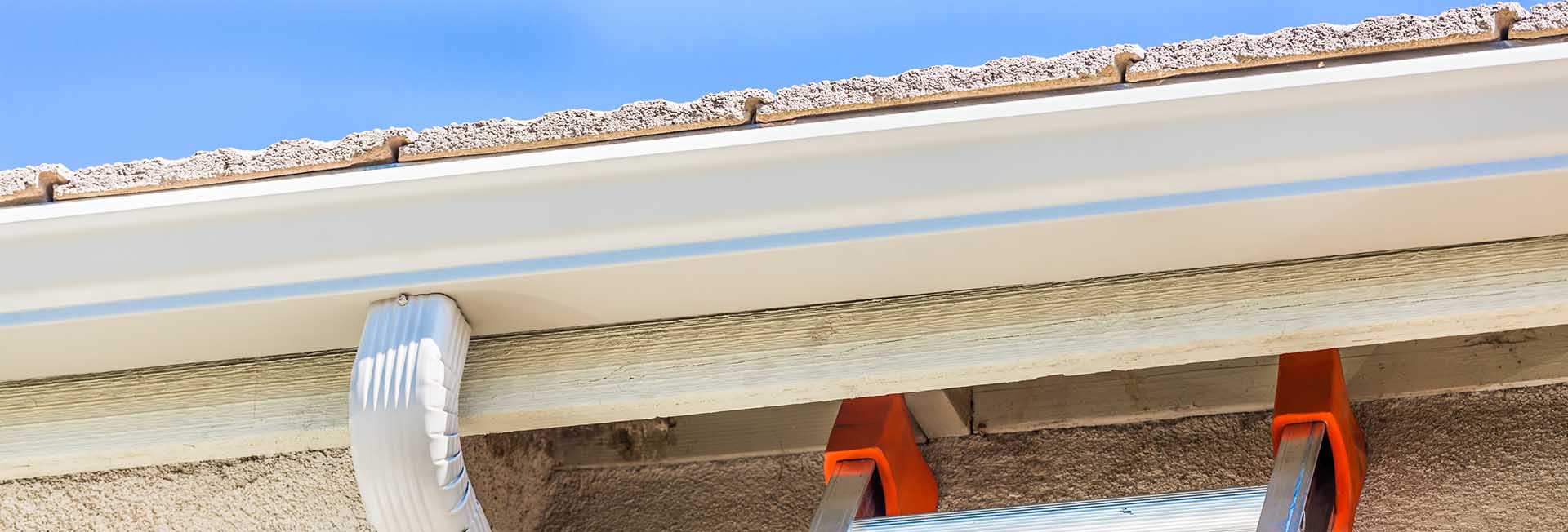 House with new seamless aluminum rain gutters installed by Wilson Roofing in San Antonio